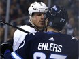 Los Angeles Kings defenceman Dion Phaneuf has a discussion with Winnipeg Jets forward Nikolaj Ehlers.