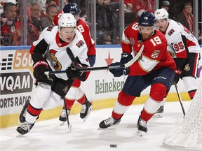 SUNRISE, FL - NOVEMBER 11: Michael Matheson #19 of the Florida Panthers pursues Brady Tkachuk #7 of the Ottawa Senators as he circles behind the net with the puck at the BB&T Center on November 11, 2018 in Sunrise, Florida.