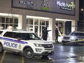 Police at the scene of a shooting at the South Keys Shopping Centre in Ottawa on Friday, Nov. 23, 2018.
