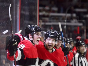 Ottawa Senators winger Drake Batherson (left) celebrates his first NHL goal with teammate Mikkel Boedker on Thursday night. (THE CANADIAN PRESS)