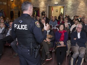 Ottawa Police Service Inspector Ken Bryden addresses Barrhaven residents in attendance at a community meeting at the Cedarhill Golf and Country Club Monday night.