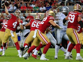 Nick Mullens of the San Francisco 49ers looks to pass against the Oakland Raiders during their NFL game at Levi's Stadium on Nov. 1, 2018 in Santa Clara, Calif.