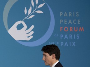 Prime Minister Justin Trudeau takes his seat for a session at the Paris Peace Forum in Paris, France, Sunday, November 11, 2018.