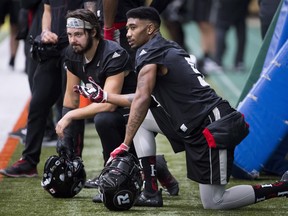 Ottawa safety Antoine Pruneau (left) is now the player from Quebec who holds the longest tenure playing for the Redblacks. (The Canadian Press)