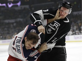 The Los Angeles Kings' Dion Phaneuf fights with the Columbus Blue Jackets' Nick Foligno on Saturday, Nov. 3, 2018.