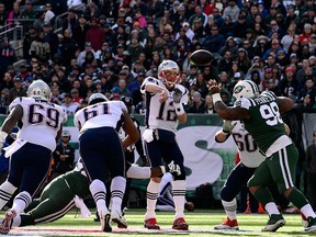 Tom Brady of the New England Patriots attempts a pass during the first quarter against the New York Jets at MetLife Stadium on Nov. 25, 2018 in East Rutherford, N.J.