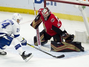 Senators goaltender Craig Anderson stops Tampa Bay Lightning winger Ryan Callahan on a breakaway in Ottawa on Sunday night. (Adrian Wyld/The Canadian Press)