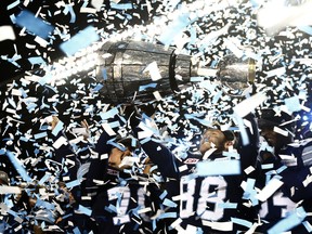 The Argonauts celebrate their Grey Cup victory last November at TD Place in Ottawa, site of their final game of 2018 tonight against the Redblacks. Since then, they've had a shocking downturn. (The Canadian Press)