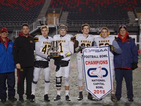 Members of the Korah Collegiate Colts show off their spoils after beating the St. Peter Knights to win the OFSAA National Capital Bowl at TD Place last night. Kendra Read OCSB