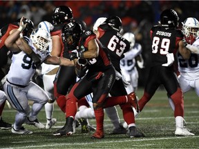 Redblacks running back Mossis Madu Jr. tries to pick a hole in the Argonauts defence on Friday night. Madu finished the contest with 78 yards on 14 carries.