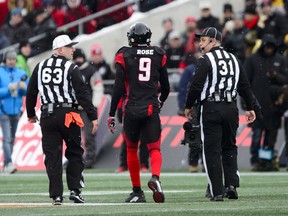 The Ottawa Redblacks' Jonathan Rose is escorted off the field during the East final. He wants to talk to the official he shoved to the ground. 'I want to apologize for getting rowdy and affecting him when he was trying to do his job.'