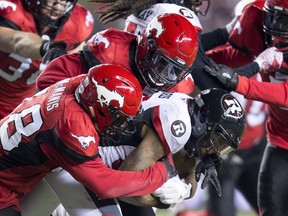 The Calgary Stampeders tackle Ottawa Redblacks wide receiver R.J. Harris (84) from running with the ball during the second half of the 106th Grey Cup in Edmonton, Alta. Sunday, Nov. 25, 2018.