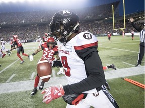 Redblacks cornerback Jonathan Rose heads out of bounds after making a first-half interception against the Stampeders in teh Grey Cup game at Edmonton on Sunday.