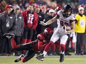 Calgary Stampeders defensive back Ciante Evans fails to tackle Ottawa Redblacks wide receiver Julian Feoli-Gudino duringn the Grey Cup game in Edmonton on Sunday, Nov. 25, 2018.