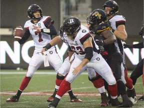 Redblacks quarterback Trevor Harris prepares to throw a pass in an Oct. 27 game against the Ticats in Hamilton.