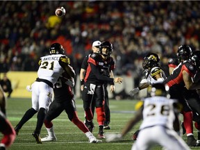 Redblacks quarterback Trevor Harris stands in the pocket to throw a pass in a game against the Tiger Cats on Oct. 19.