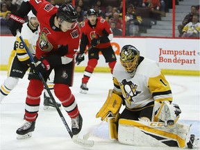 The Ottawa Senators' Brady Tkachuk attempts to tip the puck past Pittsburgh Penguins goaltender Casey DeSmith in the second period at the Canadian Tire Centre on Saturday, Nov. 17, 2018.
