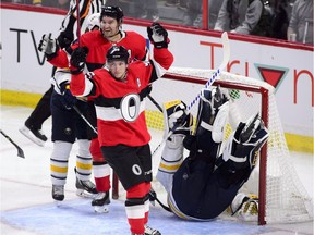 Ottawa Senators right wing Mark Stone (61) and Ottawa Senators center Matt Duchene (95) celebrate a goal on Buffalo Sabres goaltender Carter Hutton (40) during second period NHL hockey action in Ottawa on Thursday, Nov. 1, 2018. Ottawa Senators defenseman Dylan DeMelo, not shown, scored the goal.