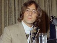 In this 1971 file photo, singer John Lennon appears during a press conference.
