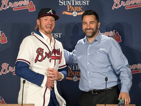 Atlanta Braves general manager Alex Anthopoulos, right, introduces Josh Donaldson during a baseball press conference Tuesday, Nov. 27, 2018, in Atlanta.