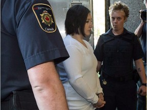 Terri-Lynne McClintic, convicted in the death of 8-year-old Woodstock, Ont., girl Victoria Stafford, is escorted into court in Kitchener, Ont., on Wednesday, September 12, 2012.