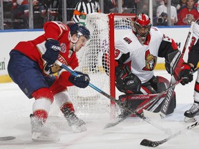 Seantors goaltender Mike McKenna stops a shot by Jared McCann of the Florida Panthers at the BB&T Center on Sunday.