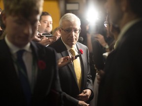 Ontario's Finance Minister Vic Fedeli scrums with journalists at Queen's Park on October 30, 2018. THE CANADIAN PRESS/Chris Young