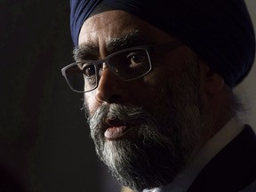 Minister of National Defence Harjit Sajjan speaks with the media following a cabinet meeting on Parliament Hill in Ottawa, Oct. 24, 2018.