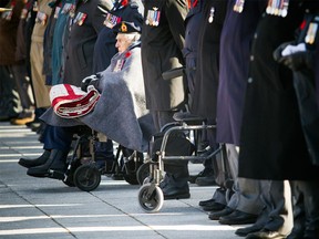 Veterans takes part in the Remembrance Day ceremony at the National War Memorial in Ottawa on Sunday.