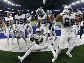 Dallas Cowboys players celebrate their win over the New Orleans Saints on Thursday, Nov. 29, 2018. Dallas won 13-10.