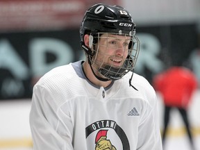 Senators forward Zack Smith wears a full cage for practice on Tuesday and will do so again when he rejoins the NHL team's lineup for Thursday's home game against the Red Wings.. Wayne Cuddington/Postmedia