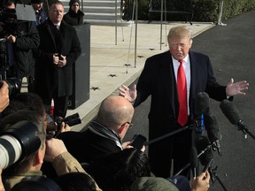 President Donald Trump speaks to reporters on the South Lawn before leaving the White House in Washington, Thursday, Nov. 29, 2018 to attend the G20 Summit in Buenos Aires, Argentina.