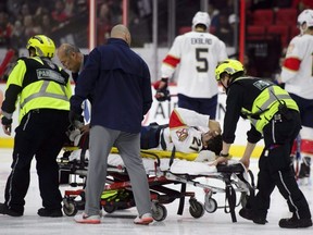 Panthers centre Vincent Trocheck is taken off the ice on a stretcher while taking on the Senators during first period NHL action in Ottawa on Monday, Nov. 19, 2018.