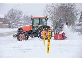 Snow clearing by private contractors in Centrepointe as the region deals with the first significant snowfall in November.