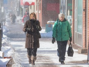 Windy cold weather made it difficult for pedestrians along Wellington Ave. Environment Canada is predicting that it will feel like -25 overnight and warns of the risk of frostbite.