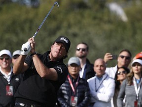 Phil Mickelson hits off the second fairway during a golf match against Tiger Woods at Shadow Creek golf course, Friday, Nov. 23, 2018, in Las Vegas.