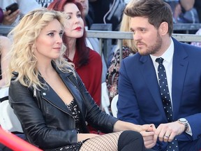 Michael Buble and wife Luisana Lopilato attend his being honored with a Star on the Hollywood Walk of Fame on November 16, 2018 in Hollywood, California.