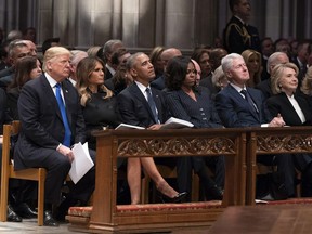 U.S. President Donald J. Trump, First Lady Melania Trump, former president Barack Obama, Michelle Obama, former president Bill Clinton and Hillary Clinton attend the state funeral service of former president George W. Bush at the National Cathedral, on Wednesday, Dec. 5, 2018 in Washington, DC.