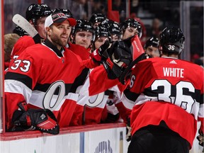 Colin White #36 of the Ottawa Senators celebrates his second period power-play goal against the Montreal Canadiens with teammate Mike McKenna #33 on Thursday.
