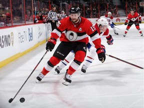 Zack Smith corals the puck as Mike Reilly of the Montreal Canadiens gives chase in the second period on Thursday.