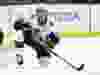 Senators defenceman Thomas Chabot gets back on his skates after taking the hit from the Islanders’ Matt Martin.