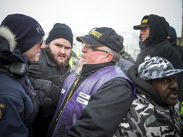 Groups opposed to Canada’s support of the UN Global Compact for Safe, Orderly and Regular Migration held a rally to protest the United Nation Global Compact for Migration while anti-fascism and anti-racism activists counter-protested, Saturday, Dec. 8, 2018 on Parliament Hill. Far-right groups get pushed into a specified area on the front lawn or Parliament.