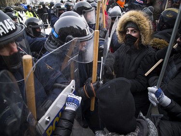 Groups opposed to Canada’s support of the UN Global Compact for Safe, Orderly and Regular Migration held a rally to protest the United Nation Global Compact for Migration while anti-fascism and anti-racism activists counter-protested, Saturday, Dec. 8, 2018 on Parliament Hill. Anti-fascism and anti-racism activists clash with RCMP and PPS authorities.