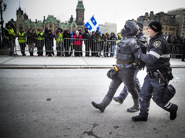 Groups opposed to Canada’s support of the UN Global Compact for Safe, Orderly and Regular Migration held a rally to protest the United Nation Global Compact for Migration while anti-fascism and anti-racism activists counter-protested, Saturday, Dec. 8, 2018 on Parliament Hill. One of multiple anti-fascism and anti-racism activists who were detained when the protest erupted.