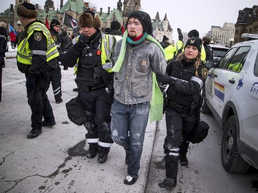 Groups opposed to Canada’s support of the UN Global Compact for Safe, Orderly and Regular Migration held a rally to protest the United Nation Global Compact for Migration while anti-fascism and anti-racism activists counter-protested, Saturday, Dec. 8, 2018 on Parliament Hill. PPS and RCMP detain an anti-fascism and anti-racism activist.
