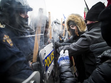 Groups opposed to Canada’s support of the UN Global Compact for Safe, Orderly and Regular Migration held a rally to protest the United Nation Global Compact for Migration while anti-fascism and anti-racism activists counter-protested, Saturday, Dec. 8, 2018 on Parliament Hill. Anti-fascism and anti-racism activists clash with RCMP and PPS authorities.