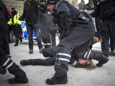 Groups opposed to Canada’s support of the UN Global Compact for Safe, Orderly and Regular Migration held a rally to protest the United Nation Global Compact for Migration while anti-fascism and anti-racism activists counter-protested, Saturday, Dec. 8, 2018 on Parliament Hill. One of multiple anti-fascism and anti-racism activists who were detained when the protest erupted.