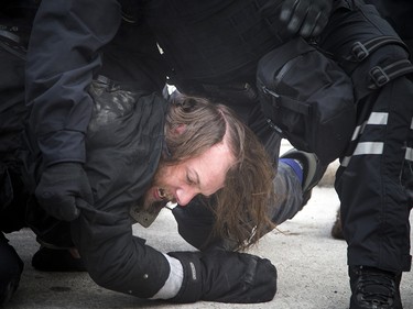 Groups opposed to Canada’s support of the UN Global Compact for Safe, Orderly and Regular Migration held a rally to protest the United Nation Global Compact for Migration while anti-fascism and anti-racism activists counter-protested, Saturday, Dec. 8, 2018 on Parliament Hill. One of multiple anti-fascism and anti-racism activists who were detained when the protest erupted.