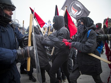Groups opposed to Canada’s support of the UN Global Compact for Safe, Orderly and Regular Migration held a rally to protest the United Nation Global Compact for Migration while anti-fascism and anti-racism activists counter-protested, Saturday, Dec. 8, 2018 on Parliament Hill. Anti-fascism and anti-racism activists clash with RCMP and PPS authorities.