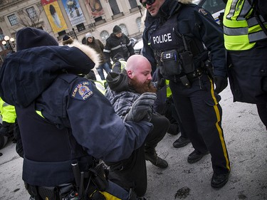 Groups opposed to Canada’s support of the UN Global Compact for Safe, Orderly and Regular Migration held a rally to protest the United Nation Global Compact for Migration while anti-fascism and anti-racism activists counter-protested, Saturday, Dec. 8, 2018 on Parliament Hill. A far-right supporter after a scuffle with police and counter protestors.